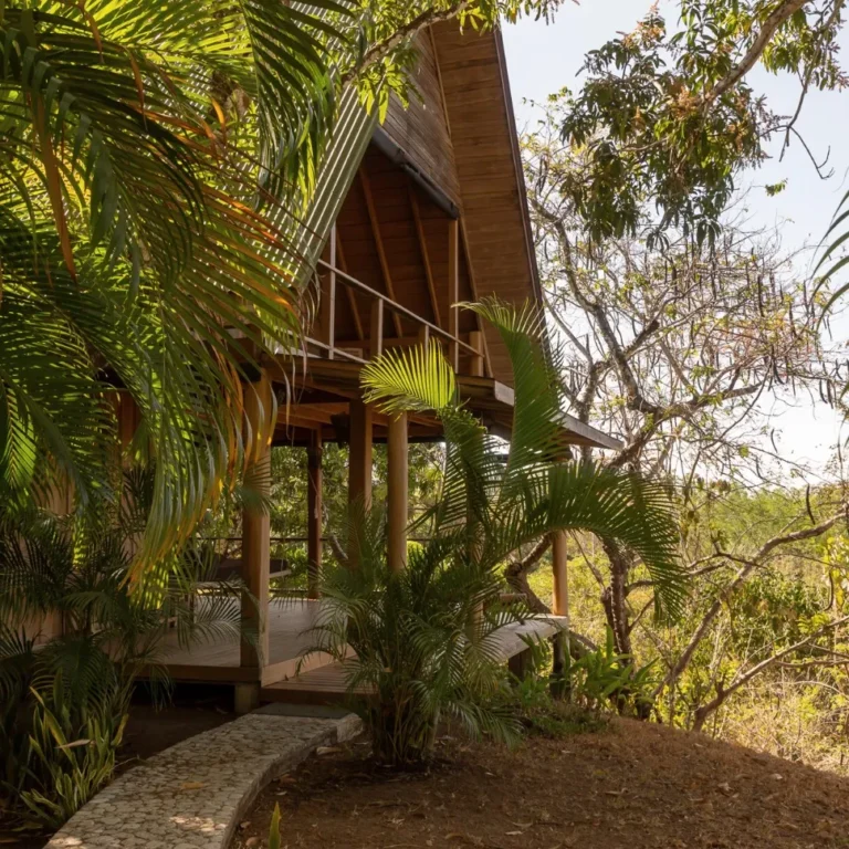 Two-story wooden main house at Calamocha Lodge on the Nicoya Peninsula, Costa Rica