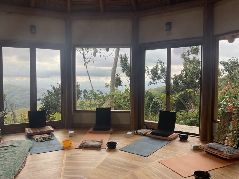 Yoga mats and bolsters laid out in the temple facing the mountains at sunrise, Costa Rica yoga retreat