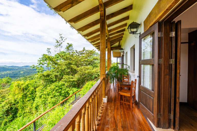Colonial balcony running along the rooms with a sweeping rainforest view, Costa Rica retreat