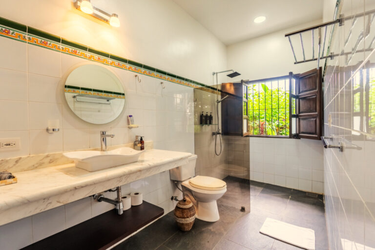Guest bathroom with a walk-in shower and a window onto the garden, Hacienda Las Vainillas Costa Rica