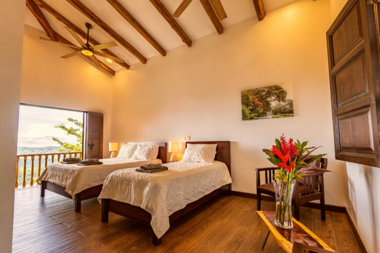 Don Cristobal room at Hacienda Las Vainillas, two beds and a private colonial balcony over the rainforest, Costa Rica